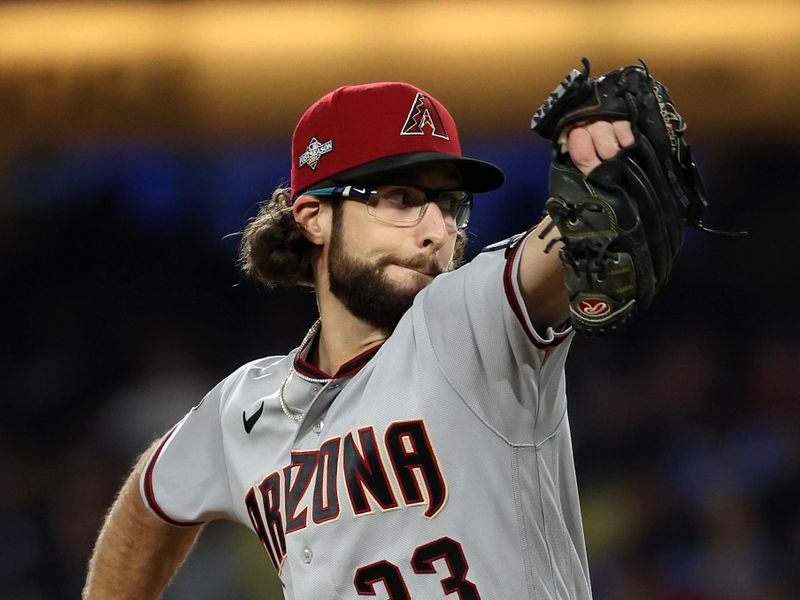 Oct 9, 2023; Los Angeles, California, USA; Arizona Diamondbacks starting pitcher Zac Gallen (23) throws a pitch in the third inning for game two of the NLDS for the 2023 MLB playoffs at Dodger Stadium. Mandatory Credit: Kiyoshi Mio-USA TODAY Sports