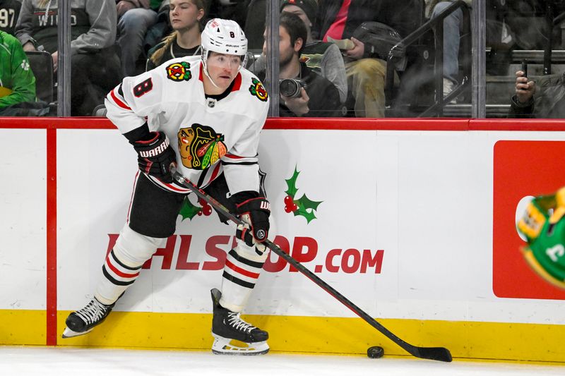 Nov 29, 2024; Saint Paul, Minnesota, USA;  Chicago Blackhawks forward Ryan Donato (8) controls the puck against the Minnesota Wild during the first period at Xcel Energy Center. Mandatory Credit: Nick Wosika-Imagn Images