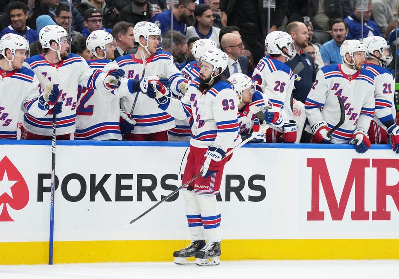 Dec 19, 2023; Toronto, Ontario, CAN; New York Rangers center Mika Zibanejad (93) celebrates at the bench after scoring an empty net goal against the Toronto Maple Leafs during the third period at Scotiabank Arena. Mandatory Credit: Nick Turchiaro-USA TODAY Sports