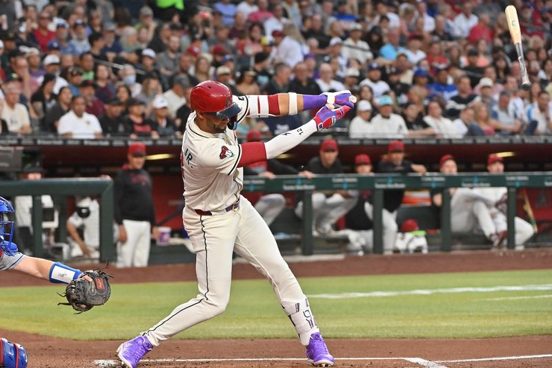 May 8, 2025; Phoenix, Arizona, USA; Arizona Diamondbacks outfielder Lourdes Gurriel Jr. (12) loses his bat in the second inning against the Los Angeles Dodgers at Chase Field. Mandatory Credit: Matt Kartozian-Imagn Images