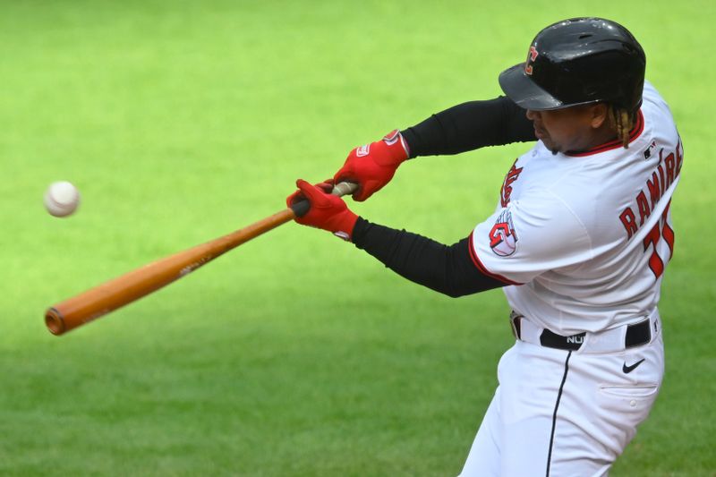 Apr 30, 2025; Cleveland, Ohio, USA; Cleveland Guardians third baseman Jose Ramirez (11) doubles in the first inning against the Minnesota Twins at Progressive Field. Mandatory Credit: David Richard-Imagn Images