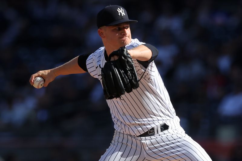 Apr 1, 2023; Bronx, New York, USA; New York Yankees starting pitcher Clarke Schmidt (36) pitches against the San Francisco Giants during the first inning at Yankee Stadium. Mandatory Credit: Brad Penner-USA TODAY Sports