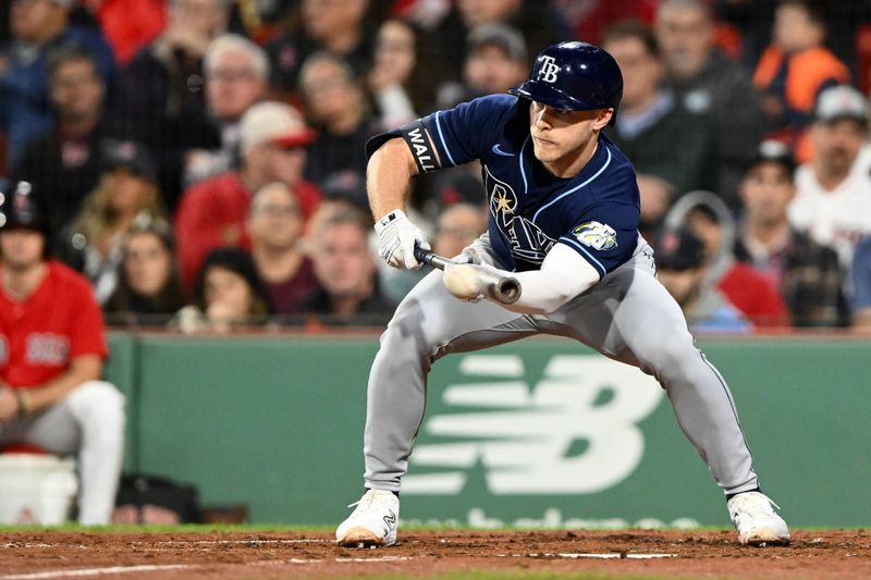 Sep 27, 2023; Boston, Massachusetts, USA; Tampa Bay Rays third baseman Taylor Walls (6) bunts against the Boston Red Sox during the fourth inning at Fenway Park. Mandatory Credit: Brian Fluharty-USA TODAY Sports