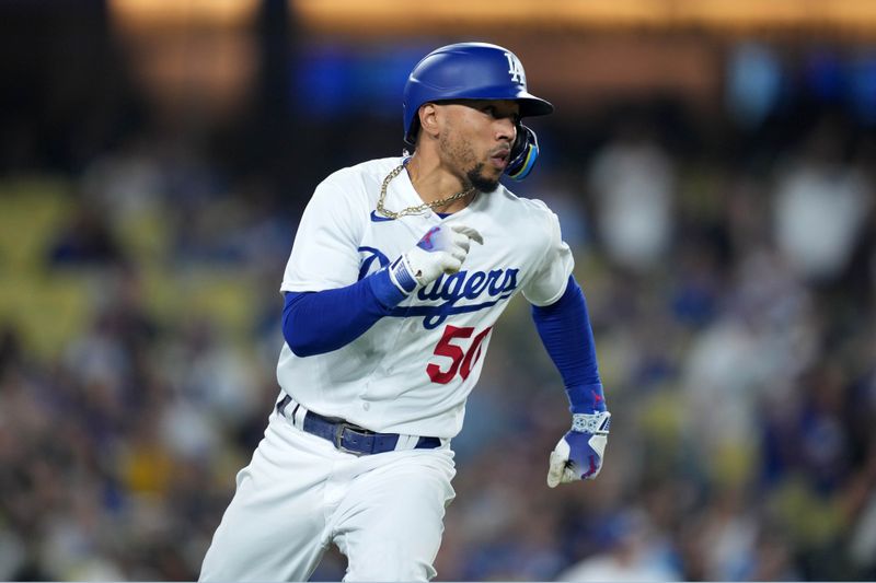 Sep 20, 2023; Los Angeles, California, USA; Los Angeles Dodgers second baseman Mookie Betts (50) rounds first base after hitting a double in the eighth inning against the Detroit Tigers at Dodger Stadium. Mandatory Credit: Kirby Lee-USA TODAY Sports