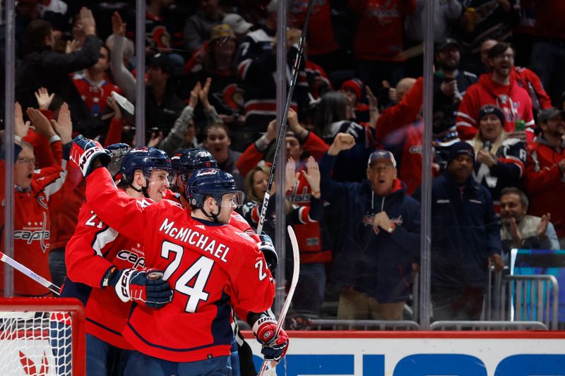 Feb 26, 2024; Washington, District of Columbia, USA; Washington Capitals center Aliaksei Protas (21) celebrates with teammates after scoring a goal against the Ottawa Senators in the first period at Capital One Arena. Mandatory Credit: Geoff Burke-USA TODAY Sports