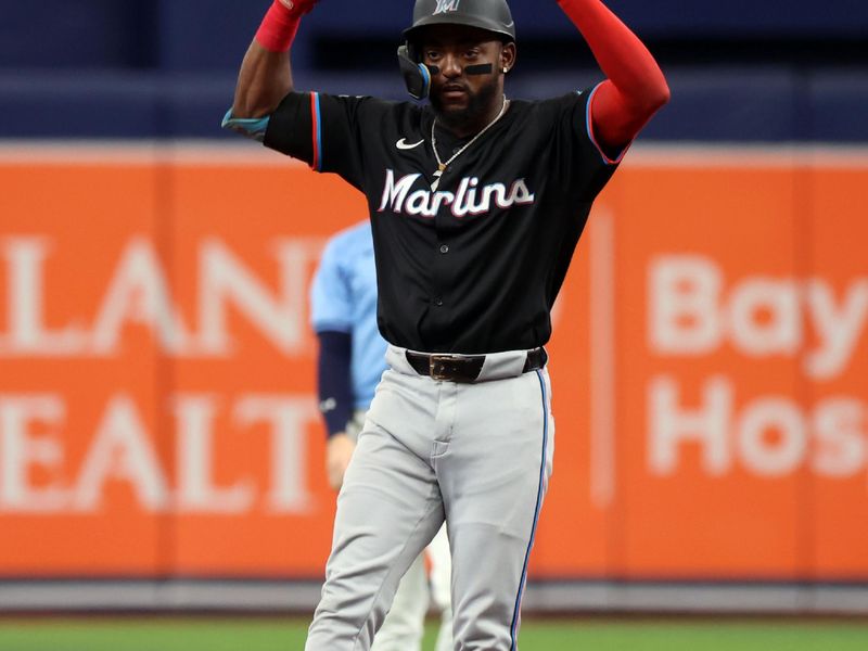 Jul 31, 2024; St. Petersburg, Florida, USA;  Miami Marlins shortstop Vidal Brujan (17) reacts after hitting a double against the Tampa Bay Rays during the third inning at Tropicana Field. Mandatory Credit: Kim Klement Neitzel-USA TODAY Sports