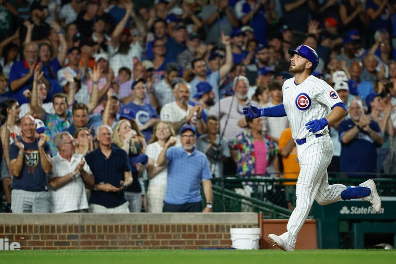 Jun 17, 2024; Chicago, Illinois, USA; Chicago Cubs first baseman Michael Busch (29) rounds the bases after hitting a two-run home run against the San Francisco Giants during the sixth inning at Wrigley Field. Mandatory Credit: Kamil Krzaczynski-USA TODAY Sports