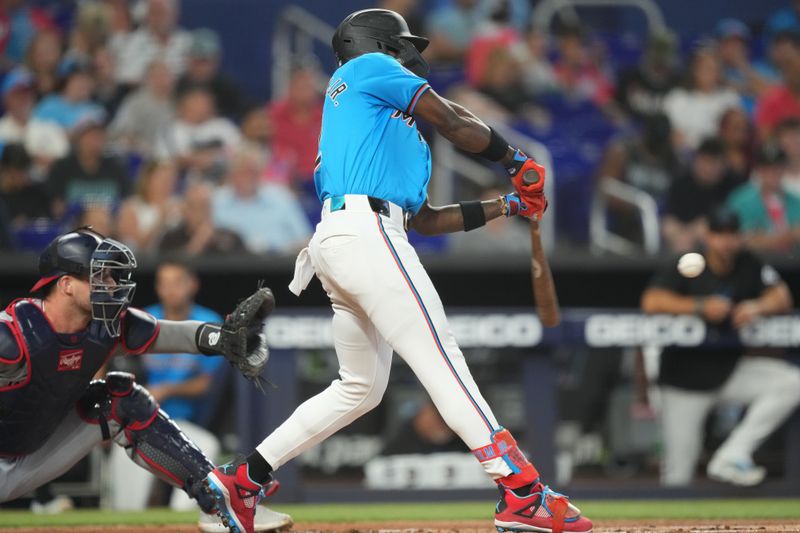 Apr 28, 2024; Miami, Florida, USA;  Miami Marlins center fielder Jazz Chisholm Jr. (2) hits a grand slam in the first inning against the Washington Nationals at loanDepot Park. Mandatory Credit: Jim Rassol-USA TODAY Sports