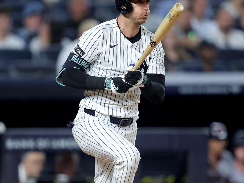 Jun 5, 2025; Bronx, New York, USA; New York Yankees right fielder Cody Bellinger (35) follows through on an RBI single against the Cleveland Guardians during the seventh inning at Yankee Stadium. Mandatory Credit: Brad Penner-Imagn Images