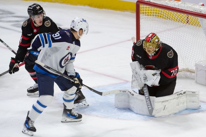 Jan 20, 2024; Ottawa, Ontario, CAN;  Ottawa Senators goalie Joonas Korpisalo (70) makes a save in front of Winnipeg Jets center Cole Perfetti (91) in the third period at the Canadian Tire Centre. Mandatory Credit: Marc DesRosiers-USA TODAY Sports