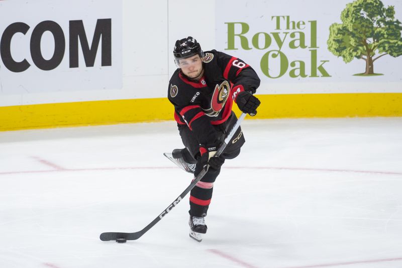 Sep 26, 2024; Ottawa, Ontario, CAN; Ottawa Senators defenseman Calen Addison (6) shoots the puck in the third period against the Buffalo Sabres at the Canadian Tire Centre. Mandatory Credit: Marc DesRosiers-Imagn Images