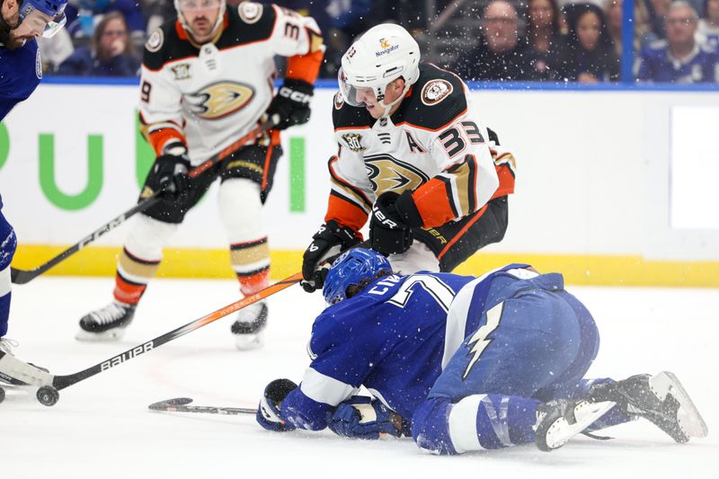 Jan 13, 2024; Tampa, Florida, USA;  Tampa Bay Lightning center Anthony Cirelli (71) and Anaheim Ducks right wing Jakob Silfverberg (33) battle for the puck in the first period  at Amalie Arena. Mandatory Credit: Nathan Ray Seebeck-USA TODAY Sports