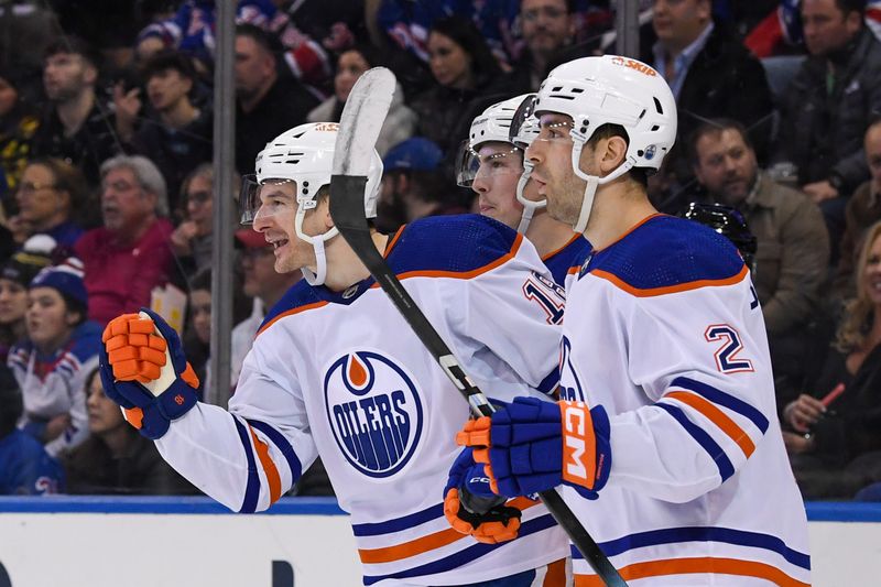 Dec 22, 2023; New York, New York, USA;  Edmonton Oilers left wing Zach Hyman (18) celebrates his goal against the New York Rangers during the third period at Madison Square Garden. Mandatory Credit: Dennis Schneidler-USA TODAY Sports