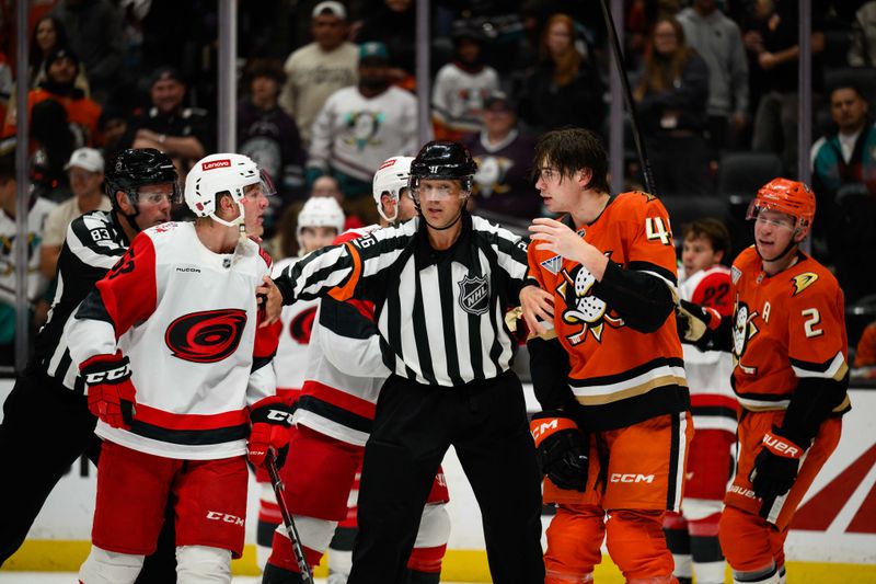 Oct 16, 2025; Anaheim, California, USA; Anaheim Ducks and Carolina Hurricanes players fight after the end of the second period at Honda Center. Mandatory Credit: William Liang-Imagn Images