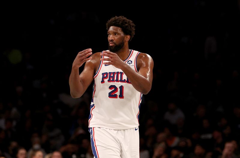 NEW YORK, NEW YORK - NOVEMBER 19:  Joel Embiid #21 of the Philadelphia 76ers reacts in the second half against the Brooklyn Nets at Barclays Center on November 19, 2023 in the Brooklyn borough of New York City. The Philadelphia 76ers defeated the Brooklyn Nets 121-99. NOTE TO USER: User expressly acknowledges and agrees that, by downloading and or using this photograph, User is consenting to the terms and conditions of the Getty Images License Agreement. (Photo by Elsa/Getty Images)