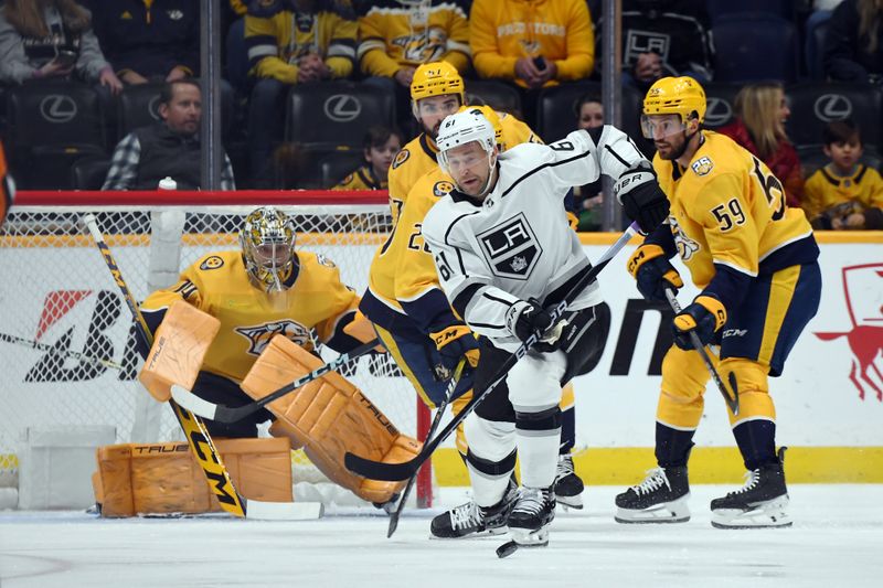 Jan 31, 2024; Nashville, Tennessee, USA; Los Angeles Kings center Trevor Lewis (61) chases down a loose puck during the first period against the Nashville Predators at Bridgestone Arena. Mandatory Credit: Christopher Hanewinckel-USA TODAY Sports