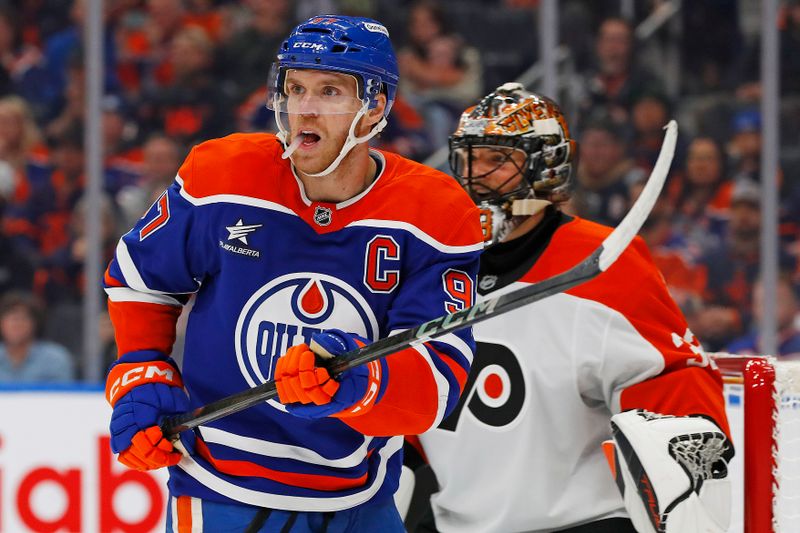 Oct 15, 2024; Edmonton, Alberta, CAN; Edmonton Oilers forward Connor McDavid (97) tries to screen  Philadelphia Flyers goaltender Samuel Ersson (33) during the first period at Rogers Place. Mandatory Credit: Perry Nelson-Imagn Images