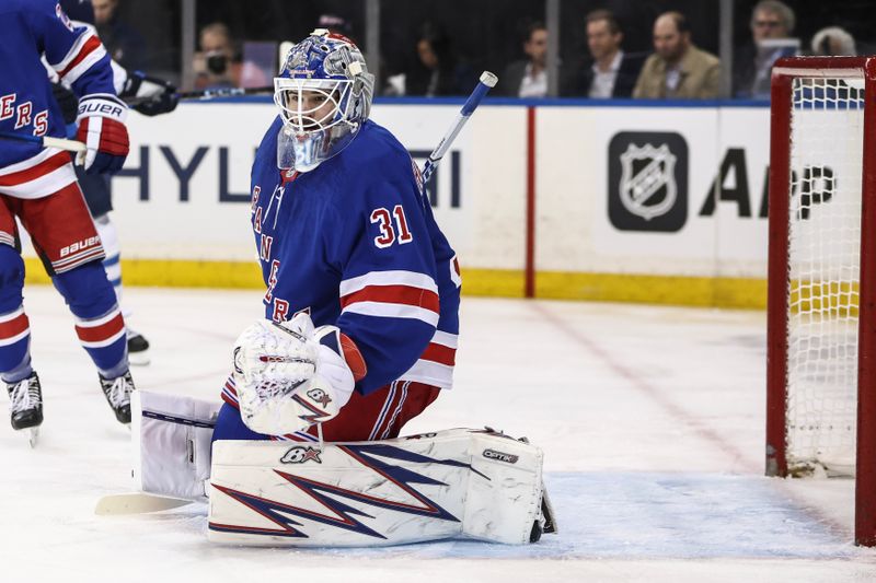 Nov 12, 2024; New York, New York, USA;  New York Rangers goaltender Igor Shesterkin (31) defends the net in the first period against the Winnipeg Jets at Madison Square Garden. Mandatory Credit: Wendell Cruz-Imagn Images