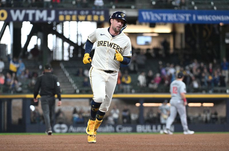 Apr 3, 2024; Milwaukee, Wisconsin, USA; Milwaukee Brewers first baseman Rhys Hoskins (12) rounds the bases after hitting a home run against the Minnesota Twins in the fourth inning at American Family Field. Mandatory Credit: Michael McLoone-USA TODAY Sports