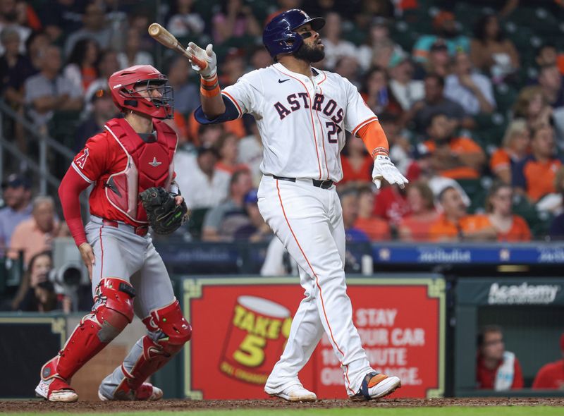 May 21, 2024; Houston, Texas, USA; Houston Astros first baseman Jon Singleton (28) hits a two-run home run during the sixth inning against the Los Angeles Angels at Minute Maid Park. Mandatory Credit: Troy Taormina-USA TODAY Sports