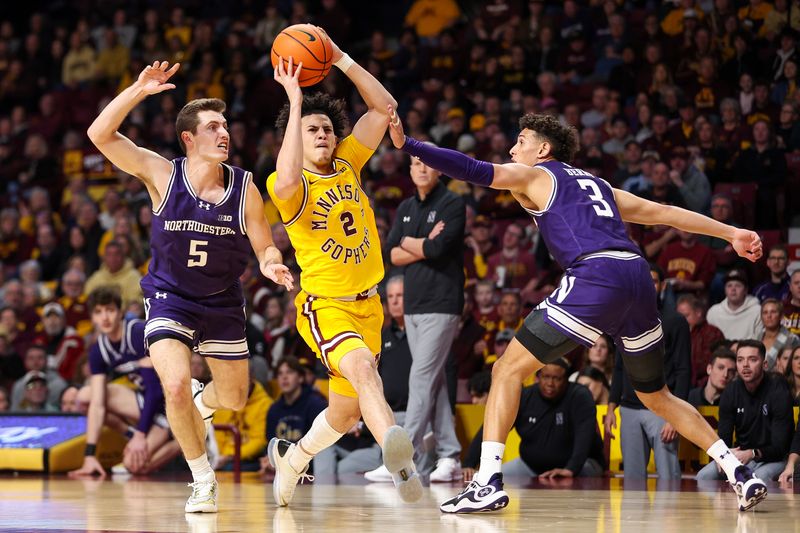 Feb 3, 2024; Minneapolis, Minnesota, USA; Minnesota Golden Gophers guard Mike Mitchell Jr. (2) works around Northwestern Wildcats guard Ryan Langborg (5) and guard Ty Berry (3) during the first half at Williams Arena. Mandatory Credit: Matt Krohn-USA TODAY Sports