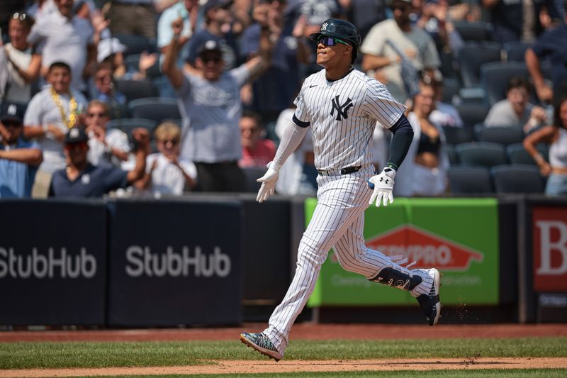 Aug 11, 2024; Bronx, New York, USA;  New York Yankees right fielder Juan Soto (22) rounds the bases after hitting a solo home run during the third inning against the Texas Rangers at Yankee Stadium. Mandatory Credit: Vincent Carchietta-USA TODAY Sports