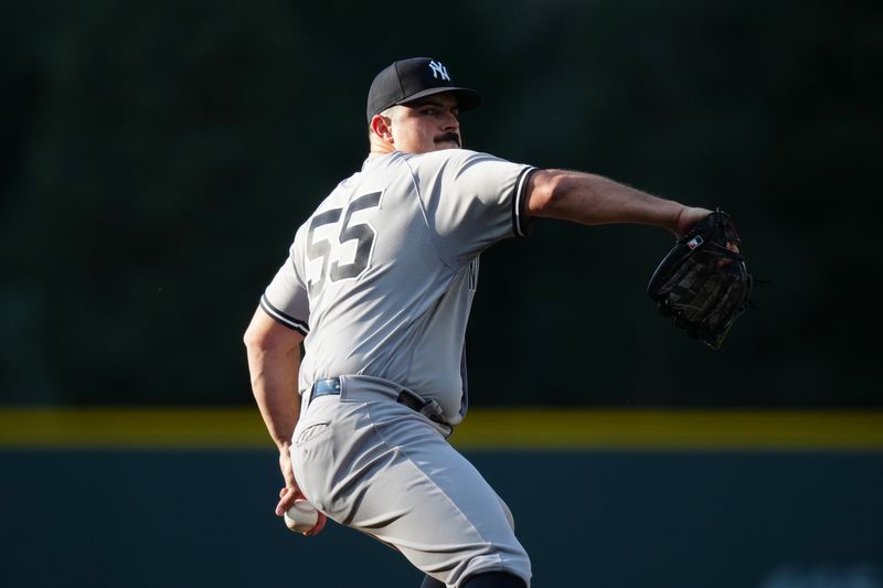 Jul 14, 2023; Denver, Colorado, USA; New York Yankees starting pitcher Carlos Rodon (55) delivers a pitch in the first inning against the Colorado Rockies at Coors Field. Mandatory Credit: Ron Chenoy-USA TODAY Sports