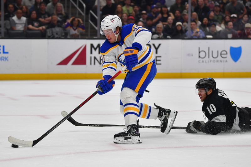 Mar 21, 2026; Los Angeles, California, USA; Buffalo Sabres right wing Josh Doan (91) moves in for a shot ahead of Los Angeles Kings left wing Artemi Panarin (10) during the first period at Crypto.com Arena. Mandatory Credit: Gary A. Vasquez-Imagn Images