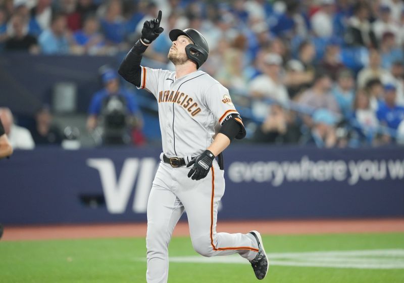 Jun 28, 2023; Toronto, Ontario, CAN; San Francisco Giants right fielder Austin Slater (13) celebrates after hitting a home run against the Toronto Blue Jays during the fifth inning at Rogers Centre. Mandatory Credit: Nick Turchiaro-USA TODAY Sports