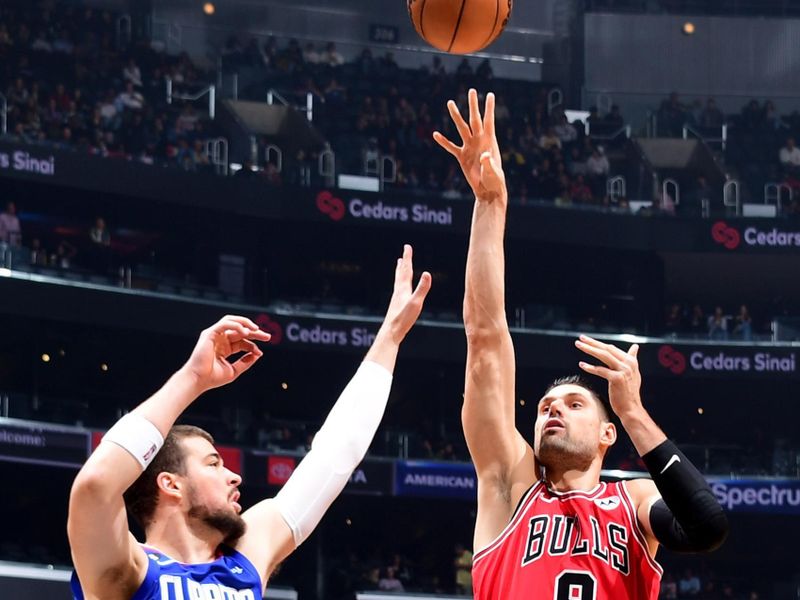 LOS ANGELES, CA - MARCH 27: Nikola Vucevic #9 of the Chicago Bulls shoots the ball during the game against the LA Clippers on March 27, 2023 at Crypto.Com Arena in Los Angeles, California. NOTE TO USER: User expressly acknowledges and agrees that, by downloading and/or using this Photograph, user is consenting to the terms and conditions of the Getty Images License Agreement. Mandatory Copyright Notice: Copyright 2023 NBAE (Photo by Adam Pantozzi/NBAE via Getty Images)