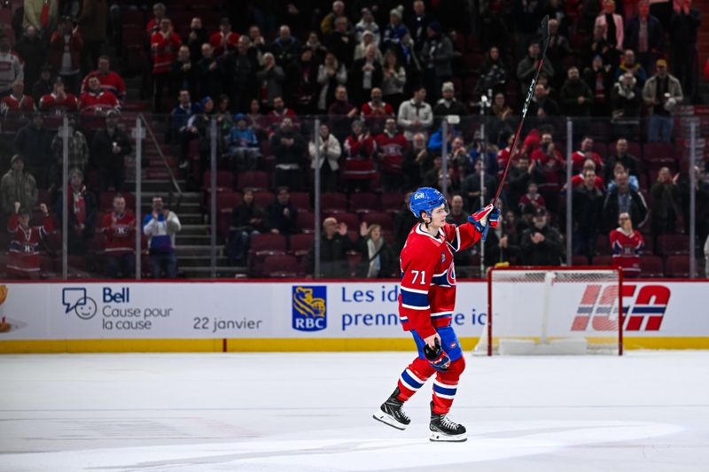 Jan 21, 2025; Montreal, Quebec, CAN; First star of the game Montreal Canadiens center Jake Evans (71) salutes the crowd after defeating the Tampa Bay Lightning at Bell Centre. Mandatory Credit: David Kirouac-Imagn Images