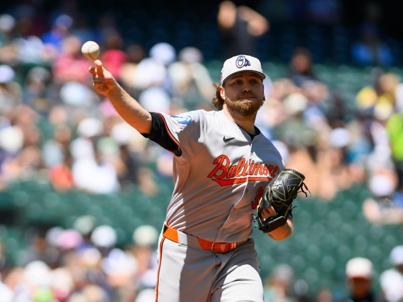 Jul 4, 2024; Seattle, Washington, USA; Baltimore Orioles starting pitcher Corbin Burnes (39) throws the ball to first base during the first inning against the Seattle Mariners at T-Mobile Park. Mandatory Credit: Steven Bisig-USA TODAY Sports