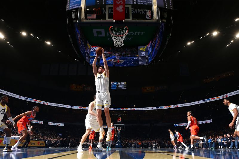 OKLAHOMA CITY, OK - DECEMBER 3: Drew Eubanks #15 of the Utah Jazz grabs the rebound during the game against the Oklahoma City Thunder during the Emirates NBA Cup game on on December 3, 2024 at Paycom Center in Oklahoma City, Oklahoma. NOTE TO USER: User expressly acknowledges and agrees that, by downloading and or using this photograph, User is consenting to the terms and conditions of the Getty Images License Agreement. Mandatory Copyright Notice: Copyright 2024 NBAE (Photo by Zach Beeker/NBAE via Getty Images)