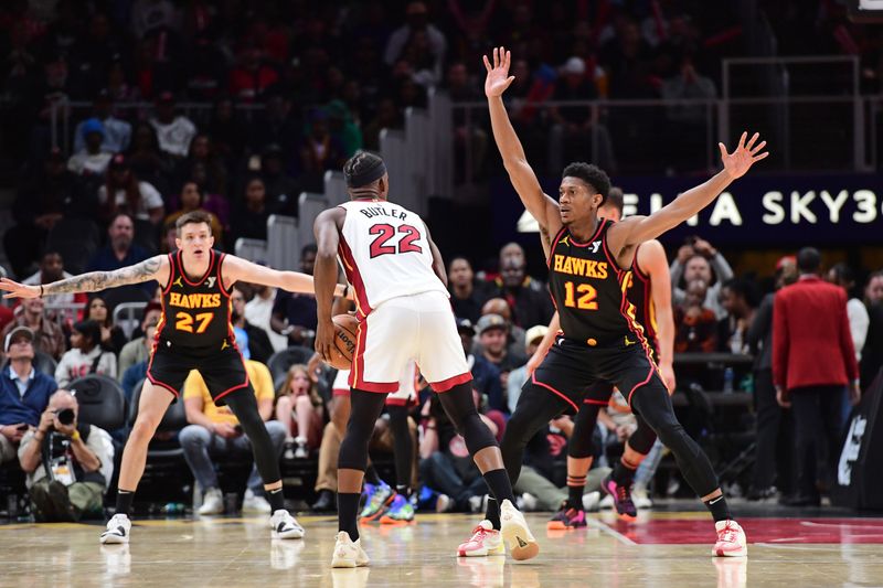 ATLANTA, GA - APRIL 9: De'Andre Hunter #12 of the Atlanta Hawks plays defense during the game against the Miami Heat on April 9, 2024 at State Farm Arena in Atlanta, Georgia.  NOTE TO USER: User expressly acknowledges and agrees that, by downloading and/or using this Photograph, user is consenting to the terms and conditions of the Getty Images License Agreement. Mandatory Copyright Notice: Copyright 2024 NBAE (Photo by Scott Cunningham/NBAE via Getty Images)