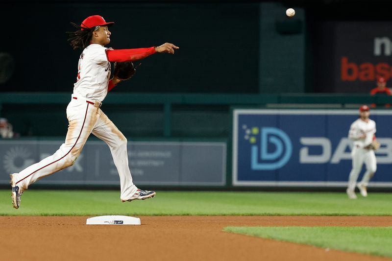 Sep 12, 2024; Washington, District of Columbia, USA; Washington Nationals shortstop CJ Abrams (5) makes a throw to first base after fielding a ground ball by Miami Marlins outfielder Cristian Pache (not pictured) during the fourth inning at Nationals Park. Mandatory Credit: Geoff Burke-Imagn Images