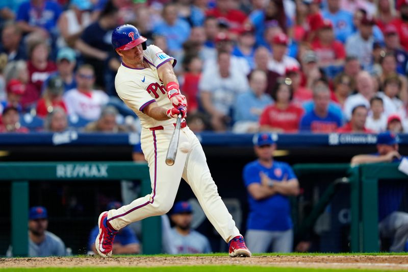 Sep 14, 2024; Philadelphia, Pennsylvania, USA; Philadelphia Phillies catcher J.T. Realmuto (10) hits an RBI double against the New York Mets during the eighth inning at Citizens Bank Park. Mandatory Credit: Gregory Fisher-Imagn Images