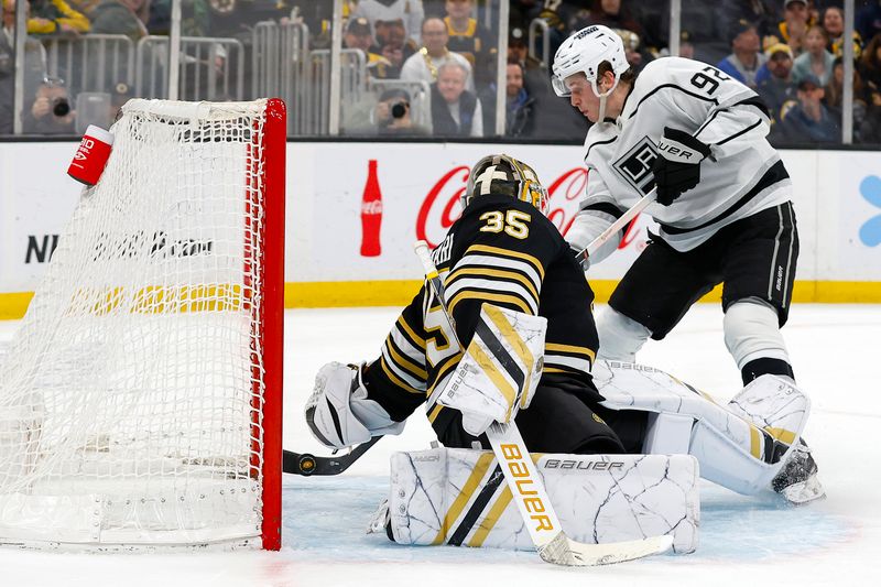 Feb 17, 2024; Boston, Massachusetts, USA; Los Angeles Kings defenseman Brandt Clarke (92) scores on Boston Bruins goaltender Linus Ullmark (35) in overtime to defeat the Boston Bruins 5-4 at TD Garden. Mandatory Credit: Winslow Townson-USA TODAY Sports