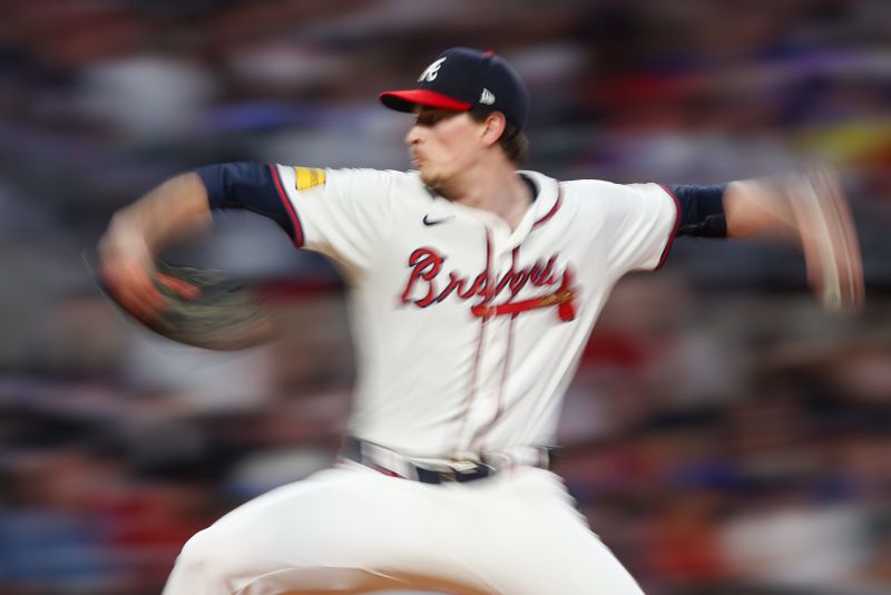 May 28, 2024; Atlanta, Georgia, USA; (Editors Note: Motion Blur) Atlanta Braves starting pitcher Max Fried (54) throws against the Washington Nationals in the eighth inning at Truist Park. Mandatory Credit: Brett Davis-USA TODAY Sports
