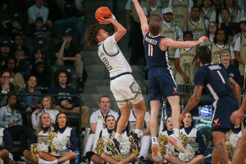 Jan 20, 2024; Atlanta, Georgia, USA; Georgia Tech Yellow Jackets guard Naithan George (2) shoots past Virginia Cavaliers guard Isaac McKneely (11) in the first half at McCamish Pavilion. Mandatory Credit: Brett Davis-USA TODAY Sports
