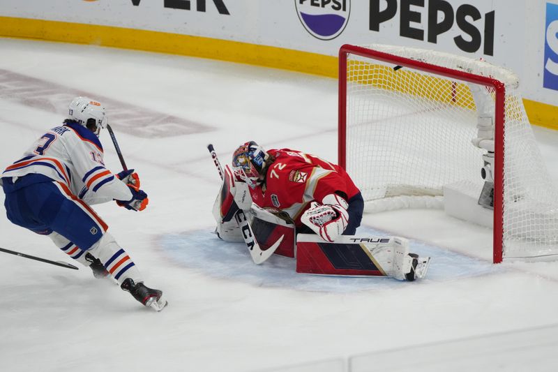 Jun 24, 2024; Sunrise, Florida, USA; Edmonton Oilers forward Mattias Janmark (13) scores against Florida Panthers goaltender Sergei Bobrovsky (72) during the first period in game seven of the 2024 Stanley Cup Final at Amerant Bank Arena. Mandatory Credit: Jim Rassol-USA TODAY Sports