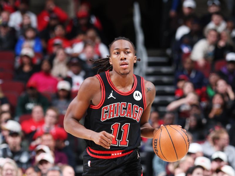 CHICAGO, IL - DECEMBER 6: Ayo Dosunmu #11 of the Chicago Bulls dribbles the ball during the game against the Indiana Pacers on December 6, 2024 at United Center in Chicago, Illinois. NOTE TO USER: User expressly acknowledges and agrees that, by downloading and or using this photograph, User is consenting to the terms and conditions of the Getty Images License Agreement. Mandatory Copyright Notice: Copyright 2024 NBAE (Photo by Jeff Haynes/NBAE via Getty Images)