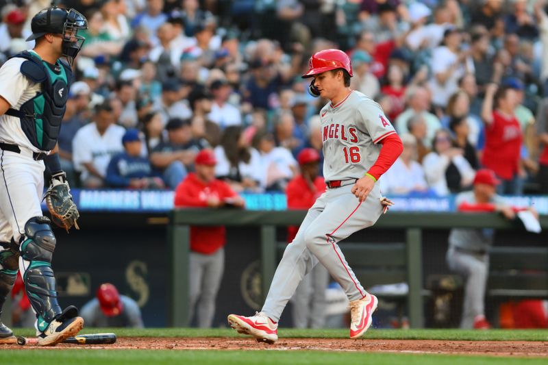 Jul 23, 2024; Seattle, Washington, USA; Los Angeles Angels center fielder Mickey Moniak (16) scores a run against the Seattle Mariners during the fifth inning at T-Mobile Park. Mandatory Credit: Steven Bisig-USA TODAY Sports