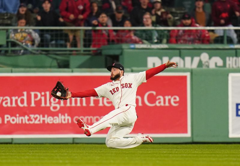 May 6, 2025; Boston, Massachusetts, USA; Boston Red Sox outfielder Wilyer Abreu (52) makes the catch against the Texas Rangers in the ninth inning at Fenway Park. Mandatory Credit: David Butler II-Imagn Images