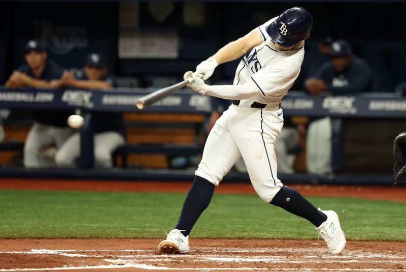 Aug 14, 2024; St. Petersburg, Florida, USA;  Tampa Bay Rays shortstop Taylor Walls (6) singles against the Houston Astros during the third inning at Tropicana Field. Mandatory Credit: Kim Klement Neitzel-USA TODAY Sports