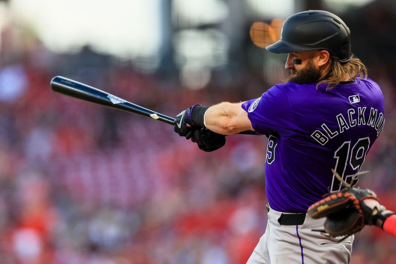 Jul 8, 2024; Cincinnati, Ohio, USA; Colorado Rockies outfielder Charlie Blackmon (19) hits a single against the Cincinnati Reds in the fourth inning at Great American Ball Park. Mandatory Credit: Katie Stratman-USA TODAY Sports