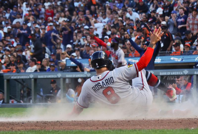 Aug 27, 2023; San Francisco, California, USA; Atlanta Braves left fielder Eddie Rosario (8) slides safely home for a run against the San Francisco Giants during the fifth inning at Oracle Park. Mandatory Credit: Kelley L Cox-USA TODAY Sports