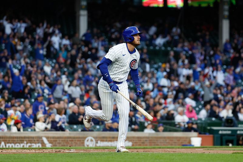 Apr 23, 2024; Chicago, Illinois, USA; Chicago Cubs outfielder Cody Bellinger (24) watches his two-run home run against the Houston Astros during the first inning at Wrigley Field. Mandatory Credit: Kamil Krzaczynski-USA TODAY Sports