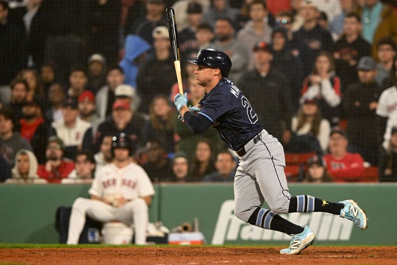 Jun 9, 2025; Boston, Massachusetts, USA; Tampa Bay Rays right fielder Jake Mangum (28) hits a RBI against the Boston Red Sox during the eleventh inning at Fenway Park. Mandatory Credit: Brian Fluharty-Imagn Images
