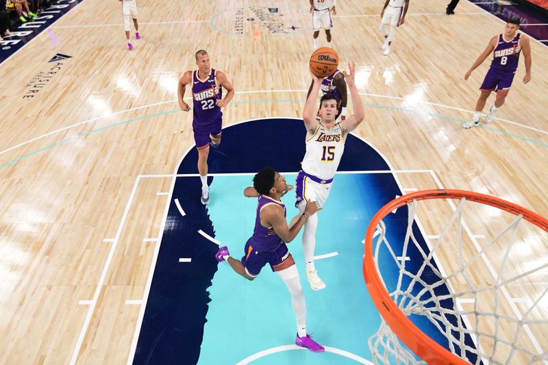 LOS ANGELES, CA - OCTOBER 6: Austin Reaves #15 of the Los Angeles Lakers drives to the basket during the game against the Phoenix Suns on October 6, 2024 at Acrisure Arena in Palm Springs, California. NOTE TO USER: User expressly acknowledges and agrees that, by downloading and/or using this Photograph, user is consenting to the terms and conditions of the Getty Images License Agreement. Mandatory Copyright Notice: Copyright 2024 NBAE (Photo by Adam Pantozzi/NBAE via Getty Images)