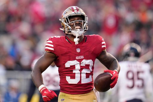 San Francisco 49ers running back Patrick Taylor Jr. (32) reacts after scoring against the Chicago Bears during the second half of an NFL football game in Santa Clara, Calif., Sunday, Dec. 8, 2024. (AP Photo/Godofredo A. Vásquez)